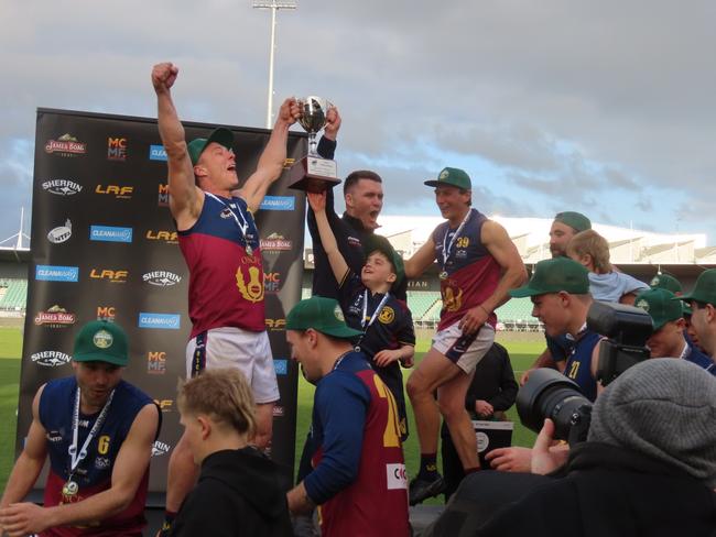 Old Scotch Collegians skipper Jonty Swallow and coach Brayley Coombes hoist the cup. Picture: Jon Tuxworth