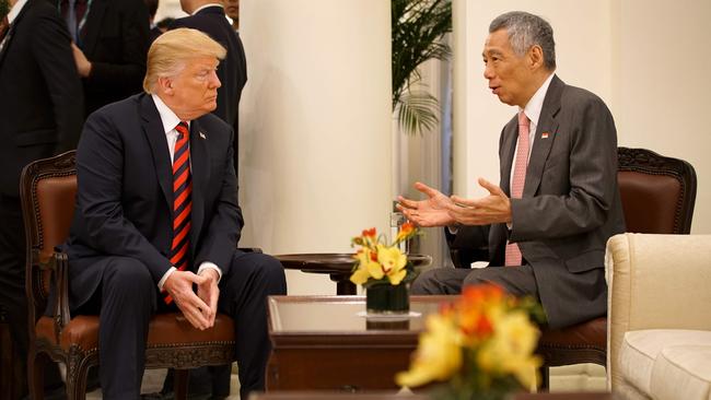 Donald Trump listens to Lee Hsien Loong. Picture: Ministry of Communications and Information of Singapore/AFP