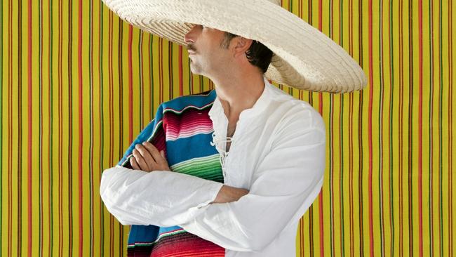 The worker alleges his colourful outfits, including a Mexican-flavoured ensemble, led to 