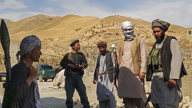 Afghan militia forces stand guard at an outpost as they patrol against the Taliban fighters in northern Takhar province. Picture: AFP