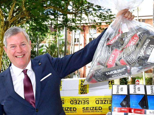 Minister for Health and Ambulance Services Tim Nicholls in Brisbane with a Public health officer and some illegal tobacco.Tuesday May 6, 2025. Picture, John Gass