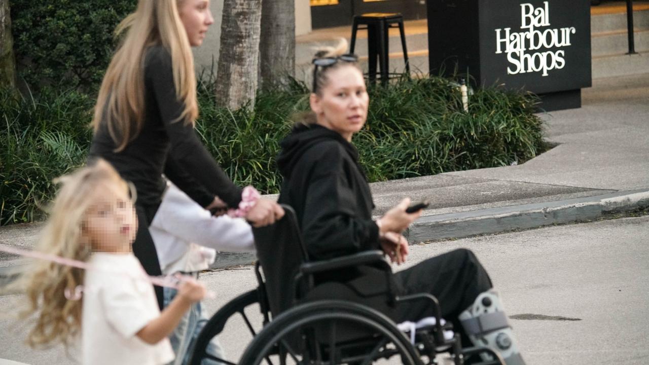 Former tennis star Anna Kournikova is seen sporting a leg brace while riding in a wheelchair. Picture: Backgrid