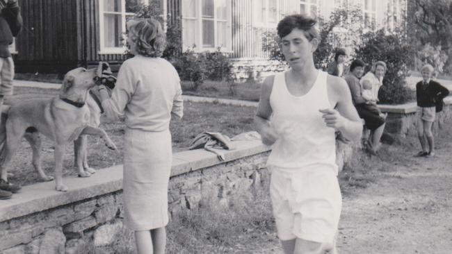 A young King Charles completing a cross-country run at Timbertop in 1966.