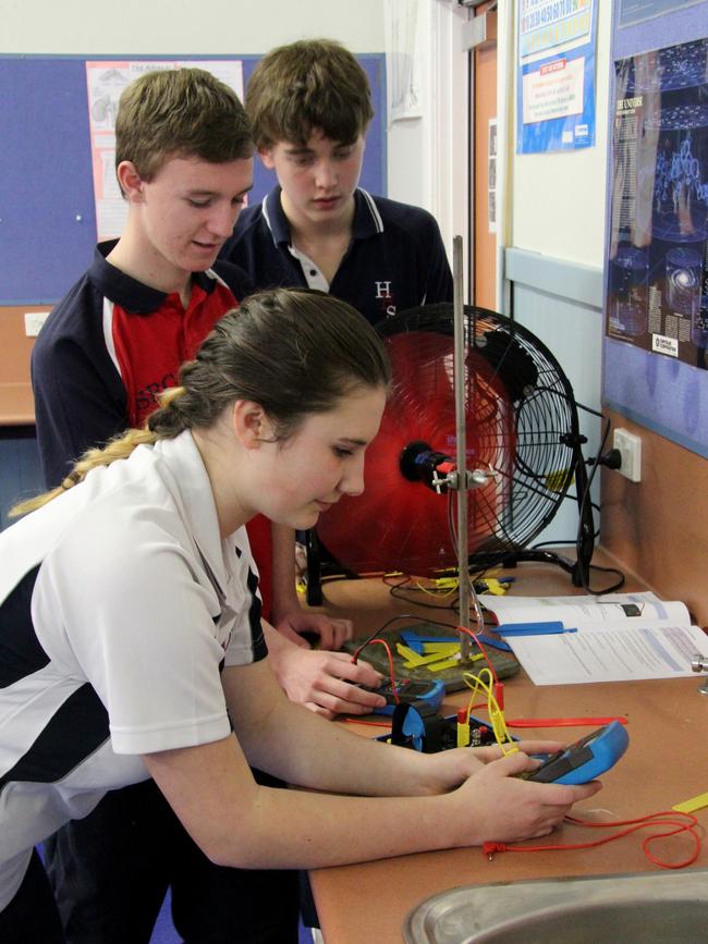 Toby Thorpe, centre, withe fellow students Zephryn Fox and Josh Hale exploring wind blade efficiency for turbines and power generation two years ago. Picture: PETER LELONG