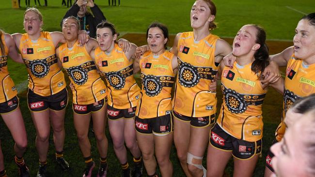 Hawks players celebrate their first ever victory after beating Sydney Swans. Picture: Morgan Hancock/AFL Photos/via Getty Images