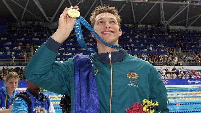 Swimmer Ian Thorpe with his gold medal after setting new world record in winning 400 freestyle at Sydney 2000 Olympic Games, Homebush, 16/09/2000.