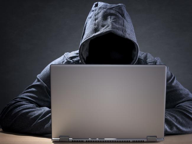 Computer hacker stealing data from a laptop concept for network security, identity theft and computer crime. Picture: iStock.