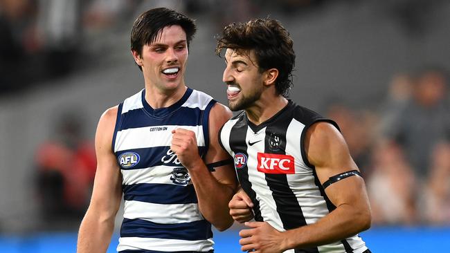 Josh Daicos lays a bump on Ollie Henry when the Pies and Cats met in round 1. Picture: Quinn Rooney/Getty Images