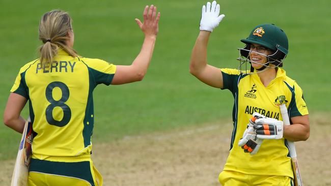 Australia batsman (L-R) Ellyse Perry and Nicole Bolton celebrate victory during the ICC Women's World Cup 2017 match between Australia and West Indies.