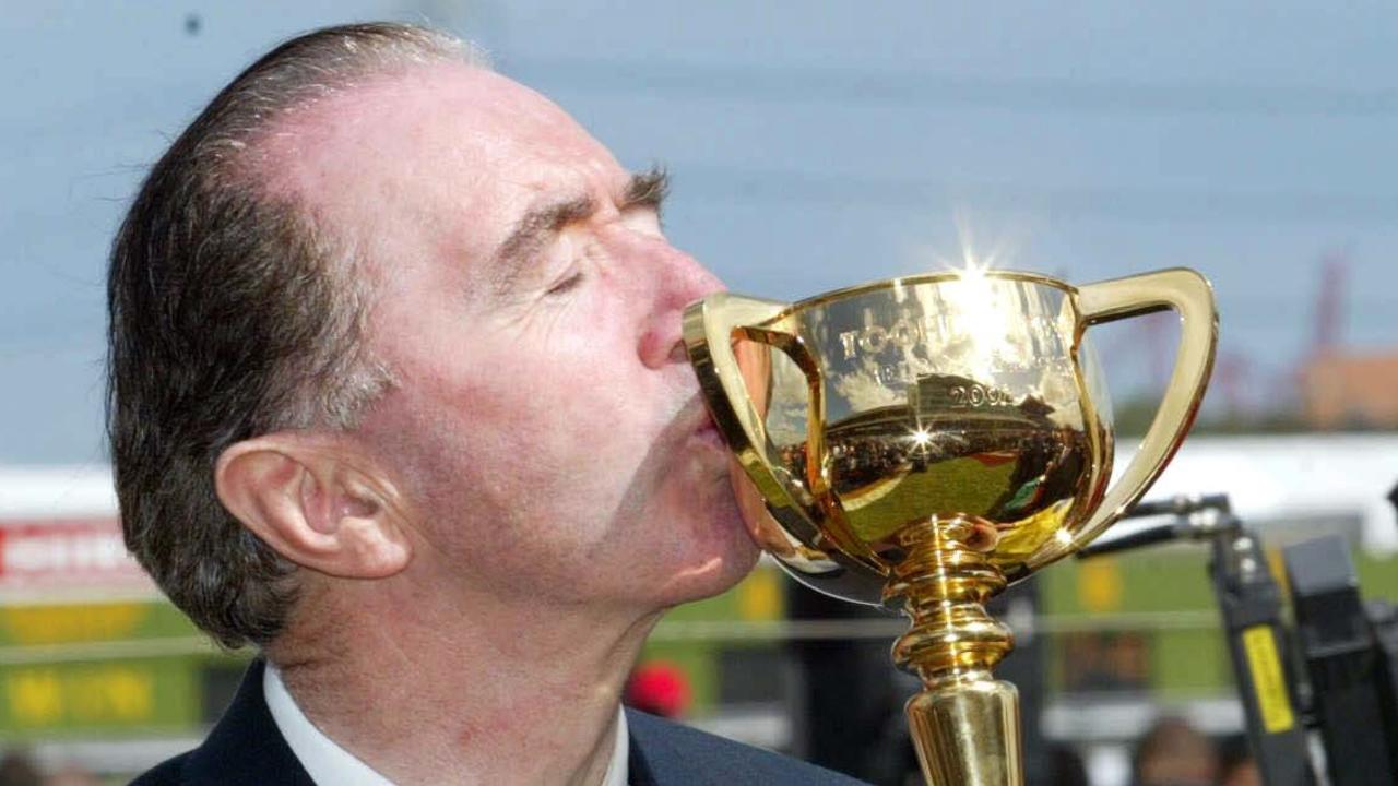 05/11/2002 PIRATE: 05/11/2002. Horse racing. Melbourne Cup day at Flemington. Irish trainer Dermot Weld kisses the Melbourne Cup after winning it with Media Puzzle.  DIGITAL IMAGE