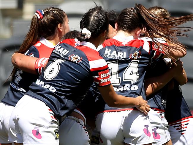 SYDNEY, AUSTRALIA - OCTOBER 10:  Zahara Temara of the Roosters   celebrates with team mates after scoring a try during the round two NRLW match between the New Zealand Warriors and the Sydney Roosters at Bankwest Stadium on October 10, 2020 in Sydney, Australia. (Photo by Mark Kolbe/Getty Images)