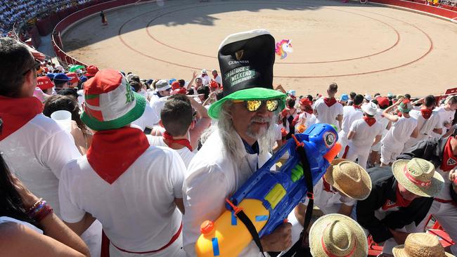 Blood money: Tourists and revellers pack the bullring before the bloodshed begins. Picture: AFP/Jose Jordan