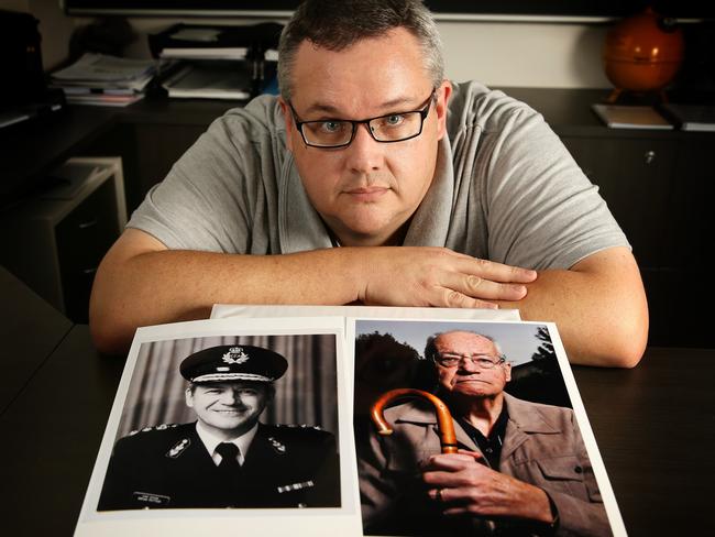 Mark Potter with a picture of his dad who died due to poisoning from the CFA Fiskville Training centre. Picture: Norm Oorloff