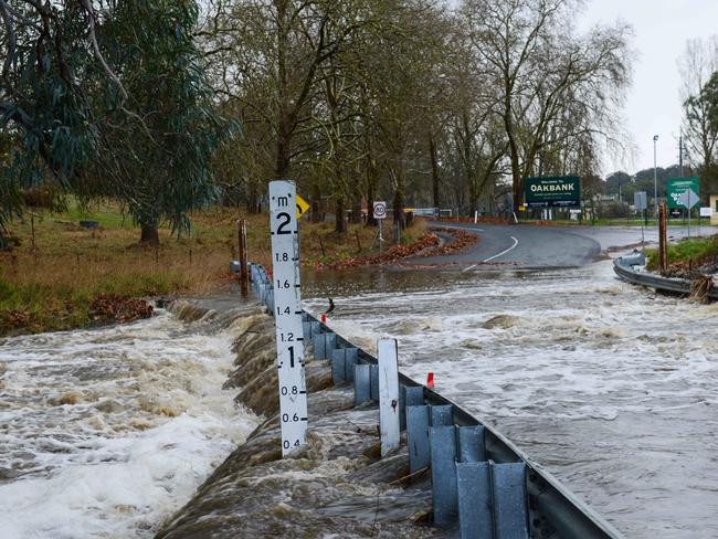 Flooded Oakwood Rd at Oakbank is closed. Picture: AAP / Brenton Edwards