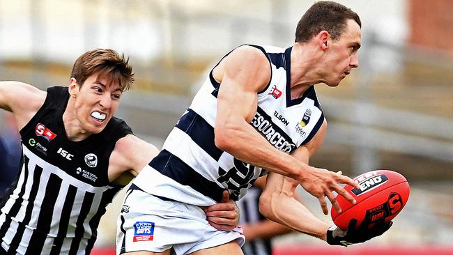 Century up ... South’s Jake Veide evades a tackle by Port Adelaide's Louis Sharrad this season. Picture: Tom Huntley