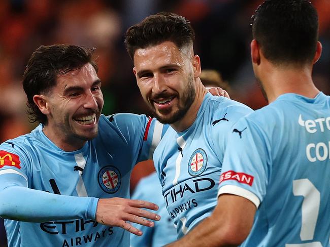 MELBOURNE, AUSTRALIA - MAY 16: Callum Talbot, Mathew Leckie and Yonatan Cohen of Melbourne City celebrate a goal  during the A-League Men Semi Final match between Western United and Melbourne City at AAMI Park, on May 16, 2025, in Melbourne, Australia. (Photo by Morgan Hancock/Getty Images)
