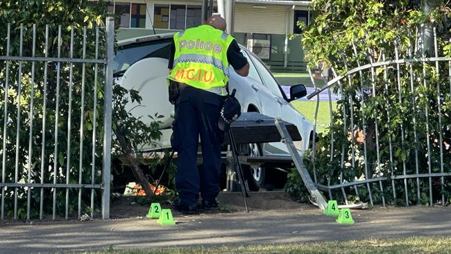 Police inspect the site of the crash at Auburn South Primary School in Hawthorn East. Picture: Mohammad Alfares