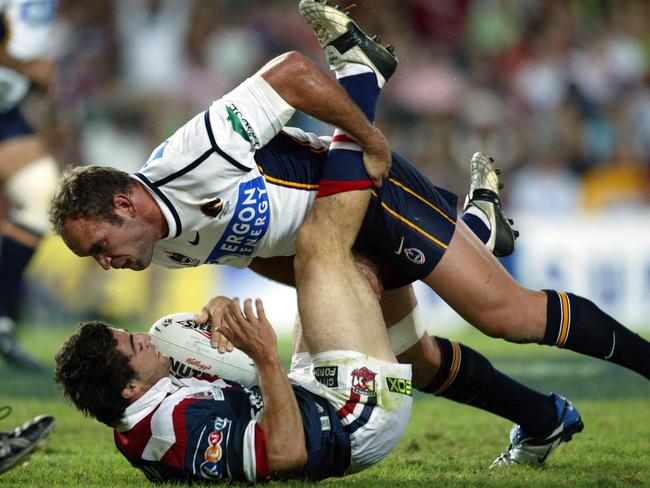 Gorden Tallis drives Anthony Minichiello backwards. Picture: Brett Costello