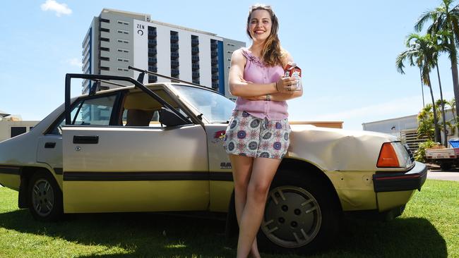 Sara Longman think's Craig Dunlop's 1986 Mitsubishi Sigma is Darwin's sexiest car. Mainly because it has a square cup holder that fits a Pauls Iced Coffee container. Picture: Hels Orr