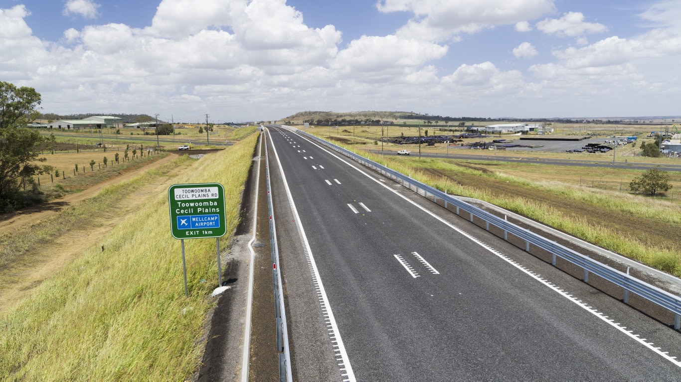 Road sign shows Toowoomba-Cecil Plains Rd and Wellcamp Airport exit on the Toowoomba Second Range Crossing.