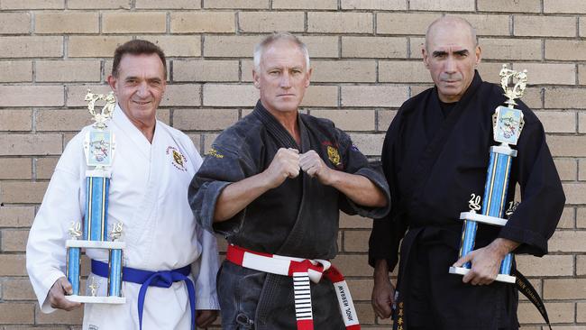 Mick Flanagan, chief Instructor Warren John and Stephen Chamberlain ofUniversal Kempo Karate celebrate their recent wins picture: David Swift