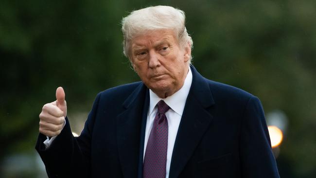 US President Donald Trump gives a thumbs up as he walks from Marine One after arriving on the South Lawn of the White House in Washington. Picture: AFP