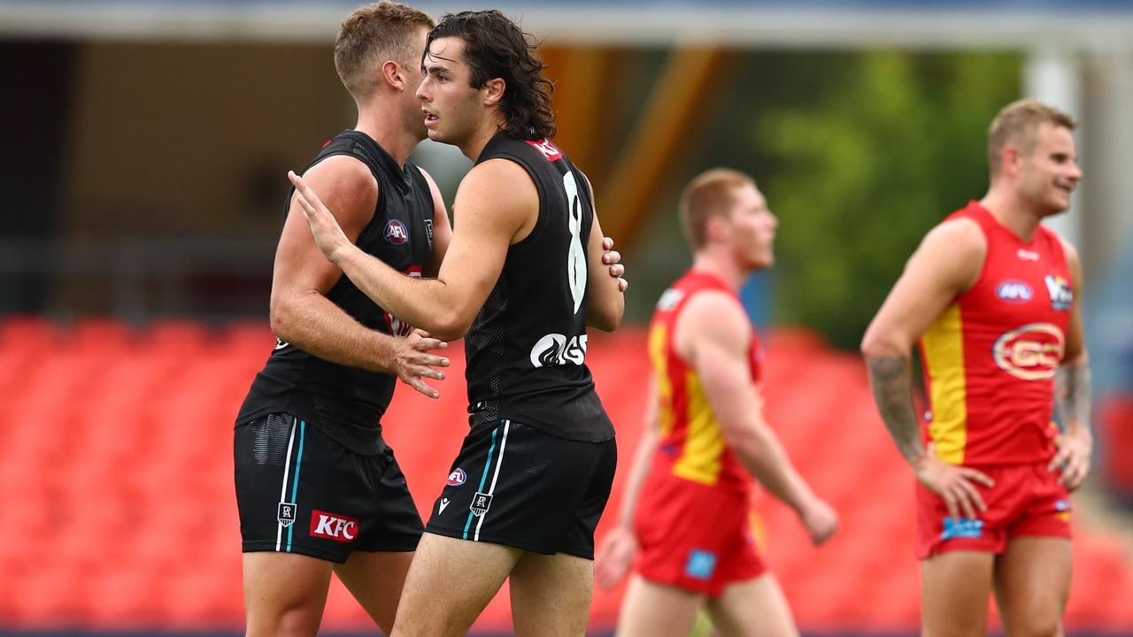 Josh Sinn celebrates his final-quarter goal with Dan Houston. Picture: Chris Hyde/Getty Images