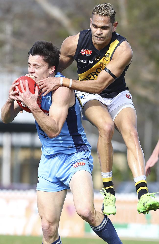 Sturt’s Jack Stephens marks in front of Glenelg’s Dom Barry. Picture: SARAH REED