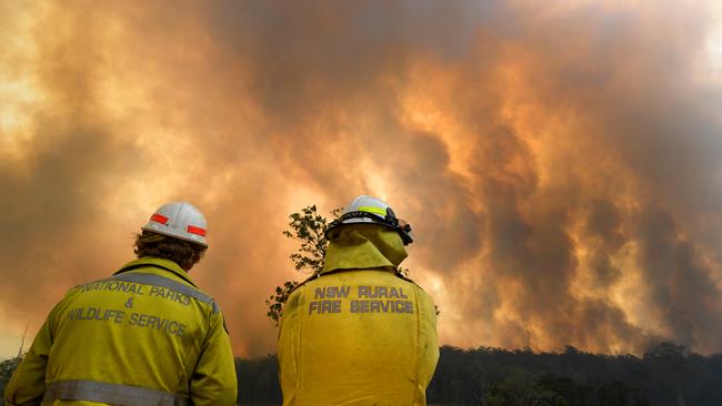 Smoke from a large bushfire outside Nana Glen, near Coffs Harbour on Tuesday. Picture: AAP Image/Dan Peled