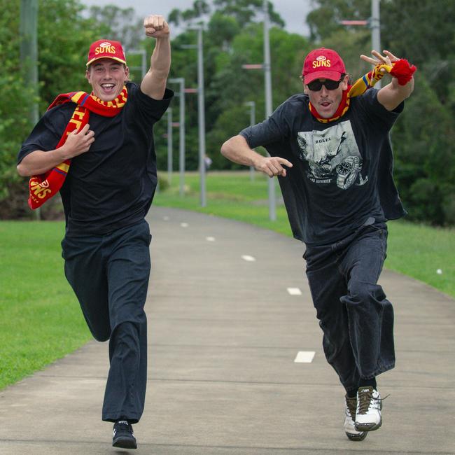 All the way from WA and running late are Suns fans Genjii Annert and Nash Margaria before the Suns V Freo at People First Stadium Cararra. Picture: Glenn Campbell