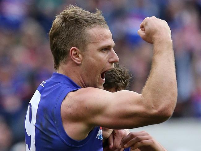 Jake Stringer kicks a goal in the fourth term of the 2016 AFL Grand Final match between the Western Bulldogs and the Sydney Swans. Picture: Wayne Ludbey