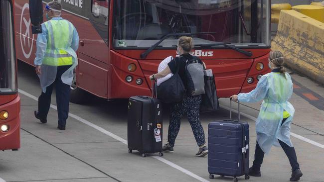 A returned traveller about to board a SkyBus. Picture: Ian Currie