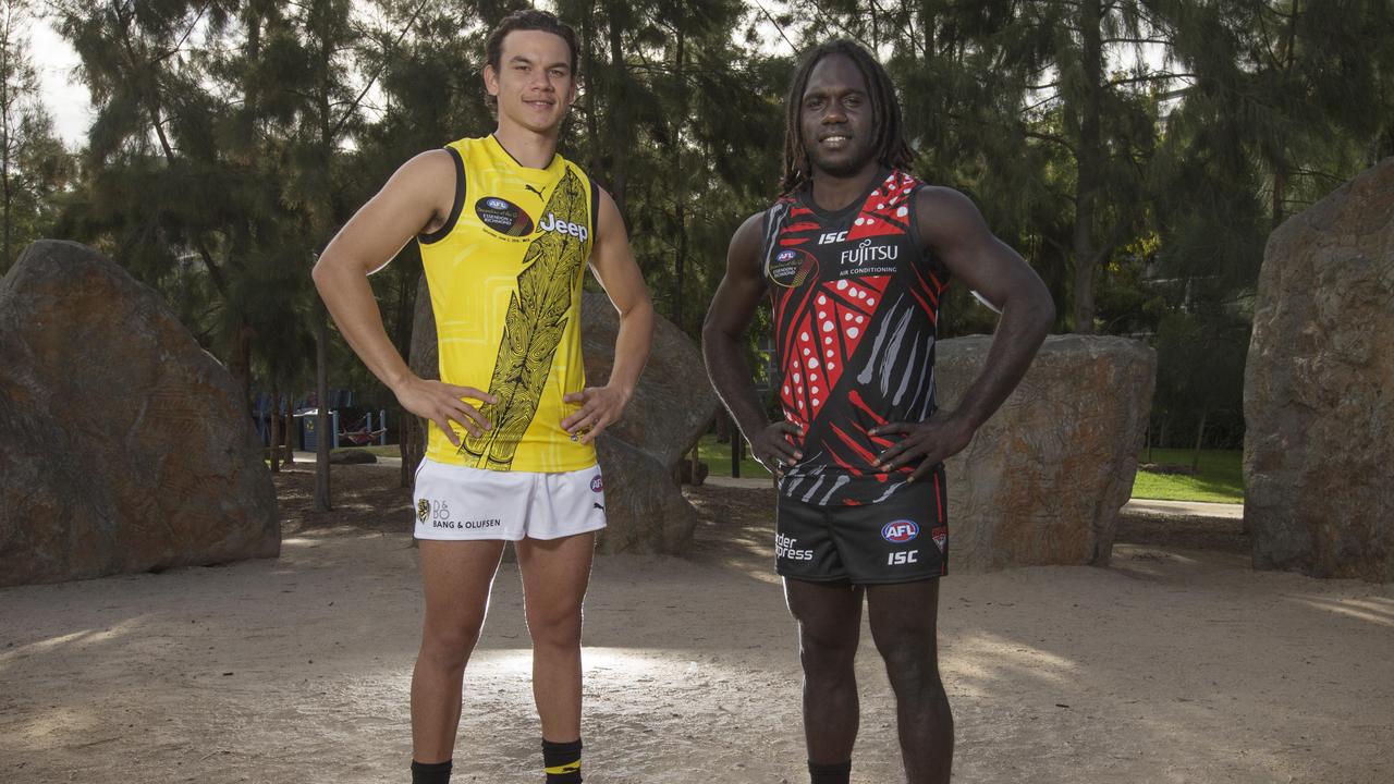 Richmond’s Daniel Rioli and Essendon's Anthony McDonald-Tipungwuti wearing this year’s Dreamtime guernseys. Picture: Michael Klein