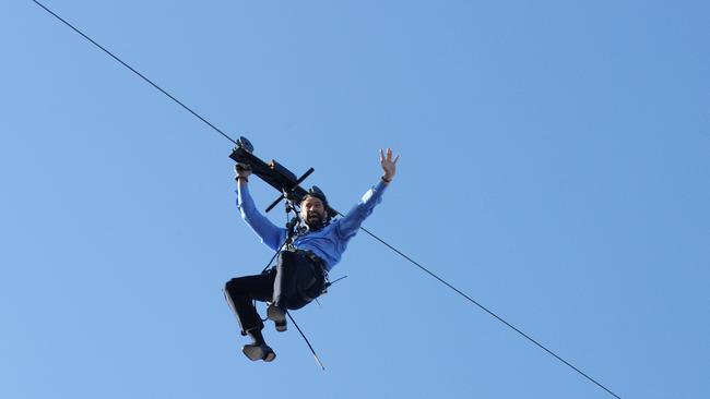 Australian actor Hugh Jackman absails from the sails of the Sydney Opera House during a stunt at the second of the Oprah Winfrey show. Picture: AAP