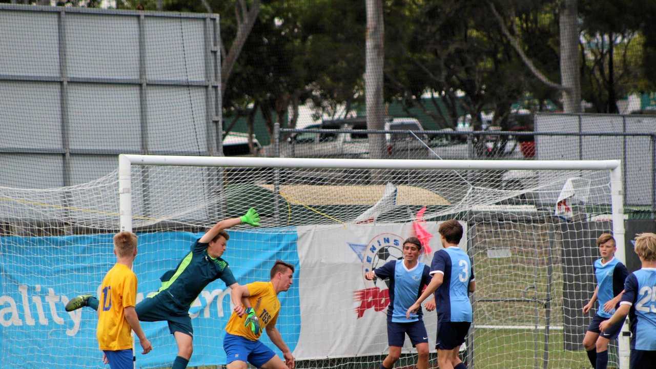 CUP CLASH: Grammar's Henry Wells challenges for the ball during his side's match against Kawana Waters State College. Picture: Rochelle Green