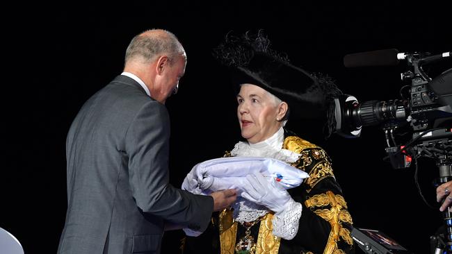 Chairman of Commonwealth Games England, Ian Metcalfe hands the Commonwealth Games Federation Flag to Mayor of the City of Birmingham, Councillor Anne Underwood during the closing ceremony.