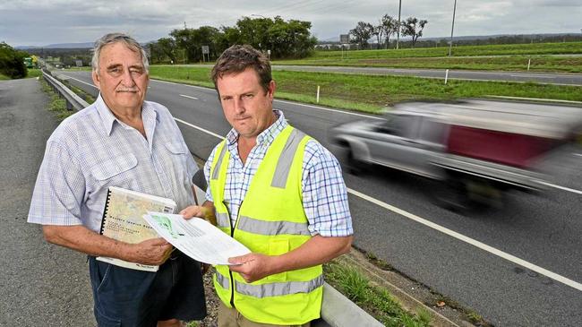 George Hatchman and Chad Hayes of the Willowbank area residents group by the Cunningham Highway. Picture: Cordell Richardson