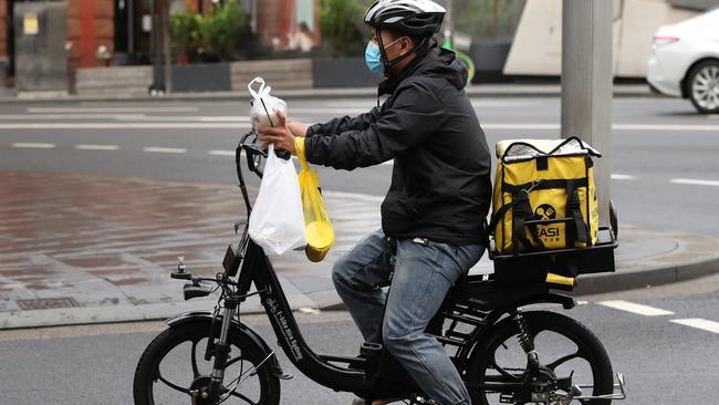 Some businesses are trying to keep workers employed by changing their roles, like from hospitality to food delivery, but they are being warned to do it properly. File Picture: David Swift