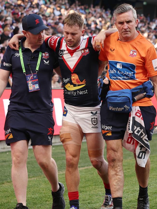 Sam Walker left the field in tremendous pain. Picture: Cameron Spencer/Getty Images