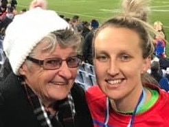 St George Dragons player Holli Wheeler and her biggest fan.