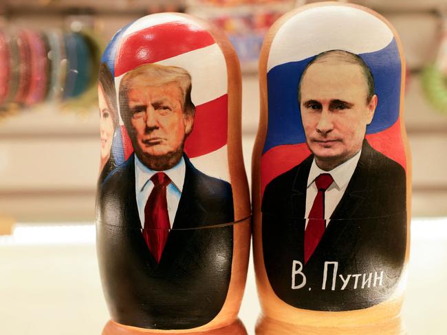 Traditional Russian wooden nesting dolls show Vladimir Putin and Donald Trump on sale in Moscow. Picture: AFP