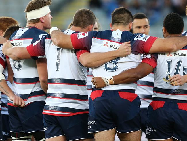 **FILE** A Saturday, April 30, 2016 image reissued Monday, April 10, 2017 of Rebels players at the start of the Round 10 Super Rugby match between the Blues and Melbourne Rebels at Eden Park in Auckland. The Western Force and Melbourne Rebels will learn within three days which of them is to be axed, Australian Rugby Union chairman Cameron Clyne says. It's part of a broader restructure of an unwieldy and unpopular Super Rugby competition format, which is to be slashed from 18 teams to 15 after this season, with two South African sides also to go. (AAP Image/David Rowland) NO ARCHIVING, EDITORIAL USE ONLY