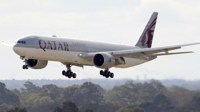 A Qatar Airways aircraft arrives with passengers from Italian cruise liners at Perth International airport in Perth, Monday, March 30, 2020.