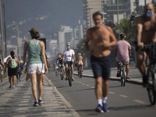 People exercise along the seashore at Ipanema beach in Rio de Janeiro. Picture: AP