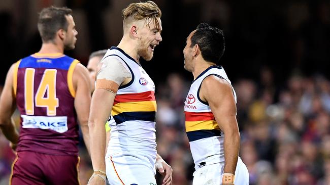 Hugh Greenwood and Eddie Betts celebrate a goal against Brisbane. Picture: BRADLEY KANARIS/GETTY IMAGES