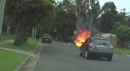 A bungling gunmen flees the scene after setting himself and his getaway car on fire.