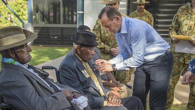 Tony Abbott presents Palm Stephen with his medals. Picture: Brain Cassey