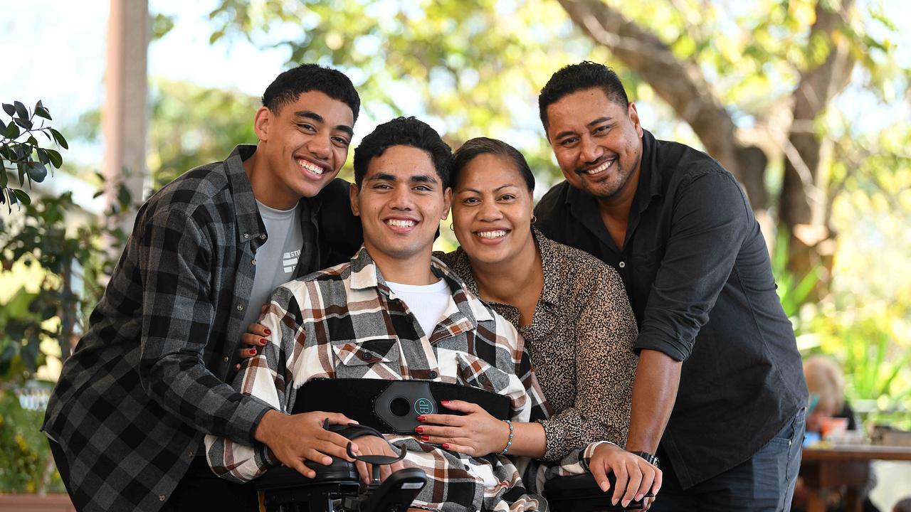 Joseph Pouniu, with family (L-R) brother Brian, mum Nuseta and father Levi. Picture: Lyndon Mechielsen/Courier Mail