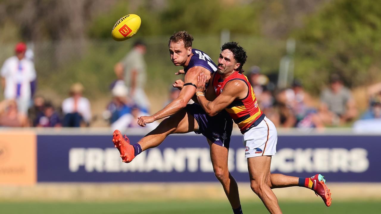 Will Brodie is tackled by Izak Rankine. Picture: Paul Kane/Getty Images