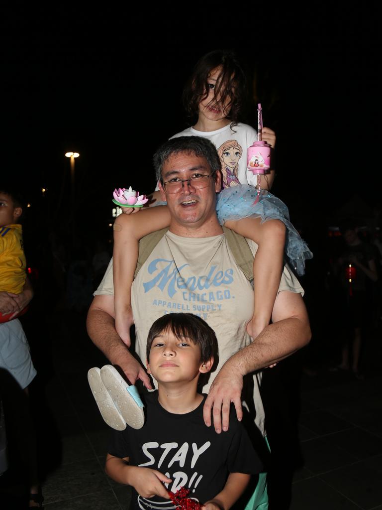 Pacey Scott, Geoffrey Scott and Dempsey Scott celebrate the last night of Chinese New Year festivities in Cairns. Picture: Kate Stephenson